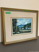 Full view of framed painting on stand