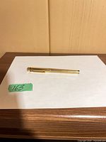 Closed pen on white background showing overall view