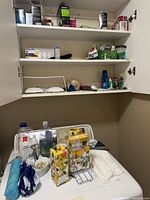 Open cabinet with light bulbs and batteries visible