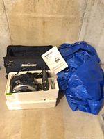 Overall lot with circular saw, jigsaw in tote, tool bag, tarp and manual