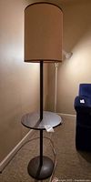 Full view of lamp with side table showing shade, shelf, base