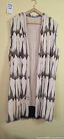 Front view of long sleeveless fur vest