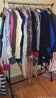 Full view of clothing rack showing all Rodier garments