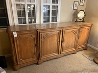 Front view of solid wood sideboard with four paneled doors