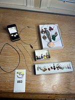 All jewellery items laid out: chains, neckwire, pendants, dangle and stud earrings