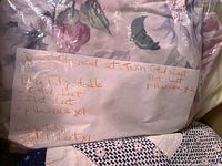 Rose floral bedding set in plastic bag with handwritten inventory note