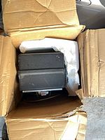 Payphone packed in cardboard box with foam inserts