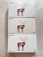 Front view of three sealed Huion Inspiroy H640P boxes