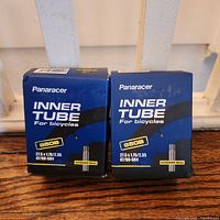 Front view showing two Panaracer inner tube boxes with size and valve info