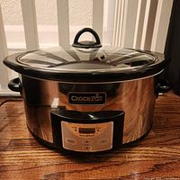 Front view of stainless steel Crock-Pot slow cooker with glass lid