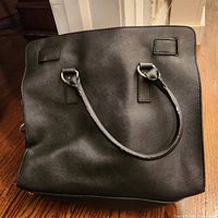 Front view of black Michael Kors handbag