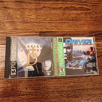 Front view of both PS1 game cases showing cover art