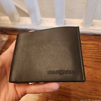 Front exterior showing SwissGear logo and leather finish