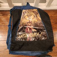 Front of blue drawstring backpack with Yu-Gi-Oh! Let’s Duel graphic