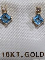 Front view of both earrings showing stones and 10KT stamp