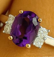 Close-up of amethyst and surrounding diamonds on ring