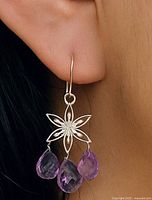 Earring worn showing scale and design