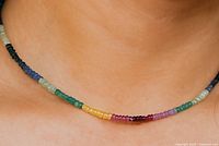 Necklace worn on model showing colour gradation