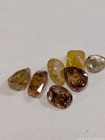 Six loose fancy-color diamonds close-up