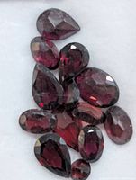 Close-up of faceted garnets showing colour and cuts
