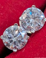 close-up of both round lab diamonds in settings