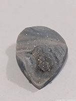 Front view of grey druzy agate showing sparkling crystal surface