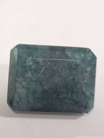Front view of rectangular green emerald stone