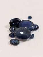 All loose blue sapphires displayed together