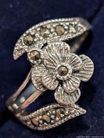 Top view of silver floral marcasite ring