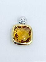 Front view of pendant showing citrine, gold bezel, diamond in bail