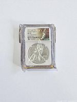 Front view of NGC-slabbed coin sealed in plastic