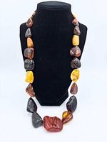 Necklace on bust showing overall appearance and bead size variation