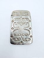 Front view of engraved sterling vesta case