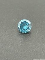 Front view of blue round brilliant diamond
