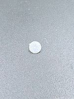 Full view of loose diamond on grey background