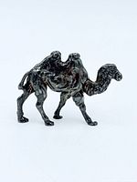 Right side view of silver camel figurine