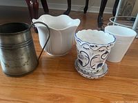 Group shot of four planters on floor