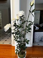 Full view of the artificial rose plant in pot