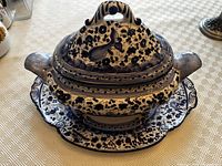 Assembled tureen with lid on underplate showing overall appearance