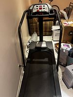 Full view of Schwinn 820P treadmill with handrails and running belt