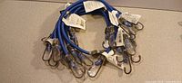 Bundle of ten blue 18-inch bungee cords showing hooks and tags