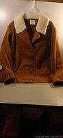 Front view of camel brown Old Navy jacket with faux sherpa collar