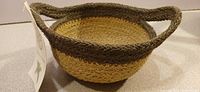 Single basket showing weave, rim and tag