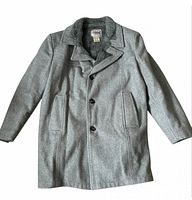 Front view of gray wool coat showing buttons, lapel and pockets