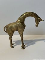 Left-front view of brass giraffe