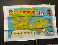 Full view of printed Canada map tea towel showing design and size