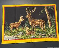 Full view of tapestry showing deer scene and borders