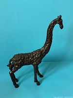 Left side view of cast iron giraffe