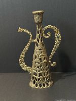 Front view showing overall form and cityscape relief