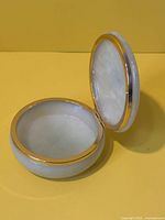 open alabaster trinket box showing interior and hinge